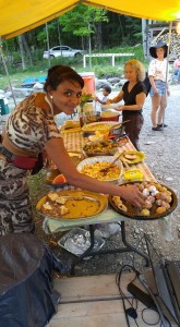 ​Deanna holding down one of five food tables.